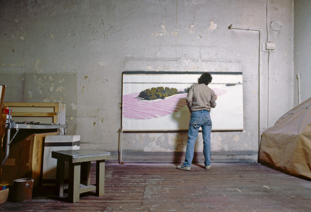 Christo in his studio working on a preparatory drawing for Surrounded Islands, New York City, 1983.
Photo: Wolfgang Volz. © Christo and Jeanne-Claude Foundation.